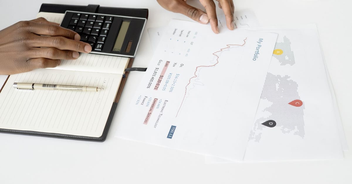 Hiring manager comparing staffing cost scenarios on a spreadsheet