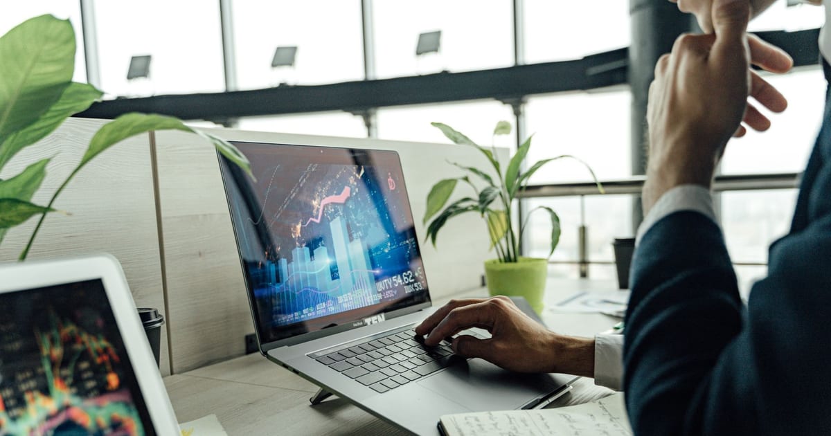Hiring manager comparing developer sourcing platforms on a laptop